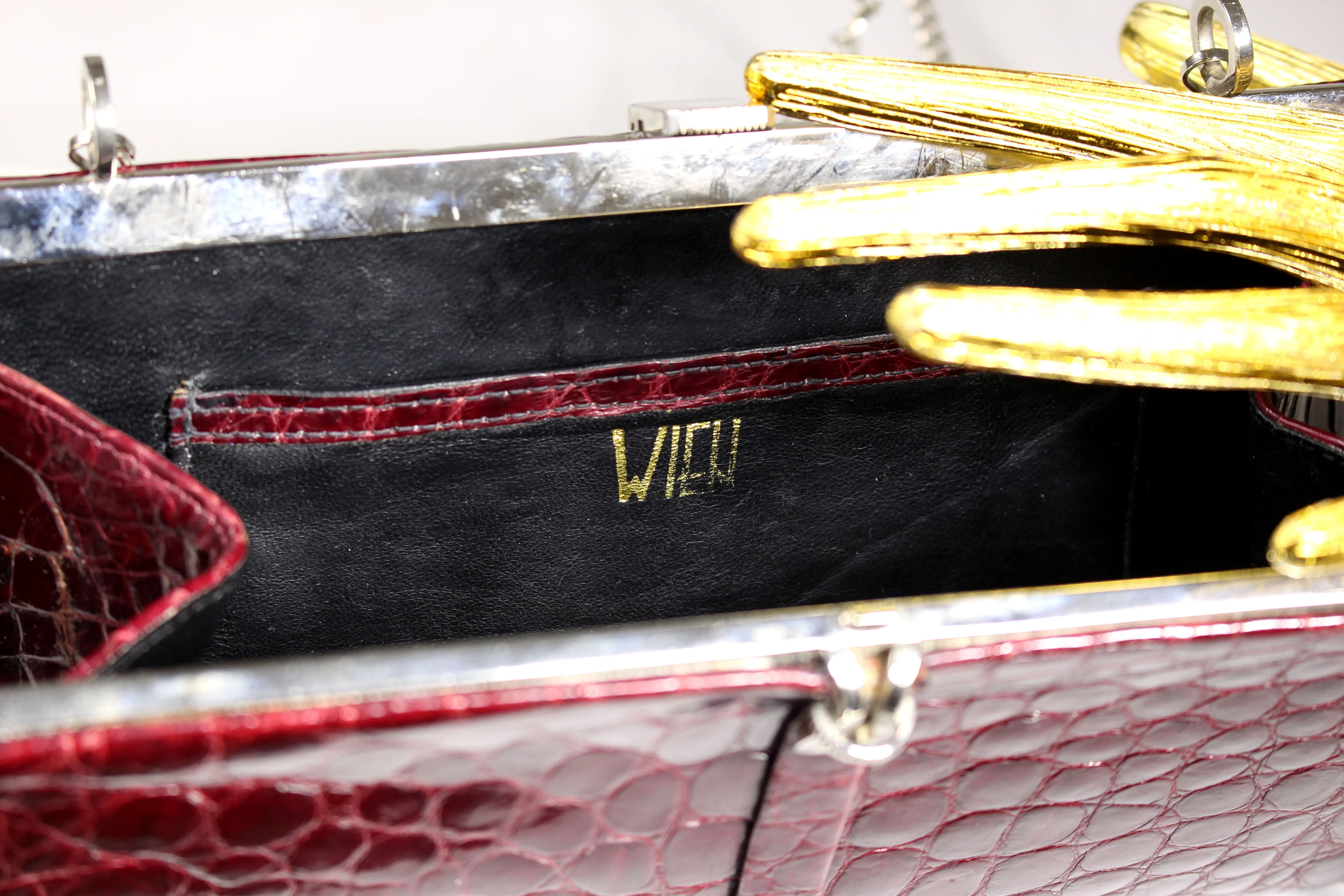 WIEN ruby red crocodile skin clutch